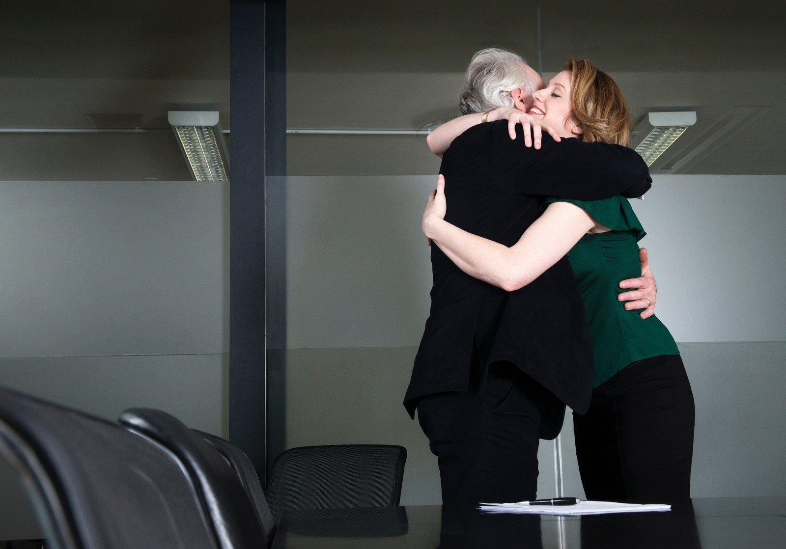 Businesspeople hugging